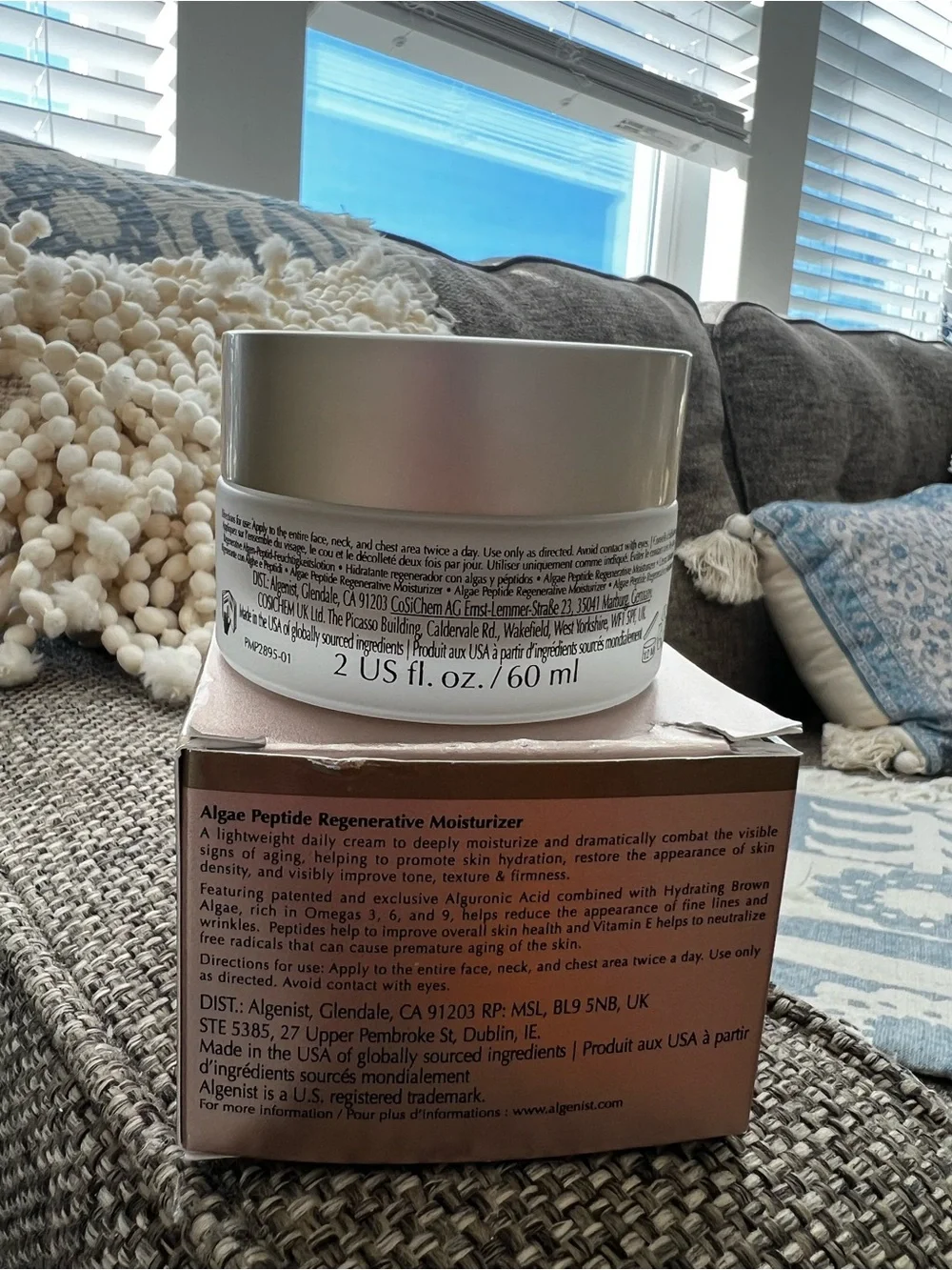 Algenist Moisturizer in Rose Gold and White